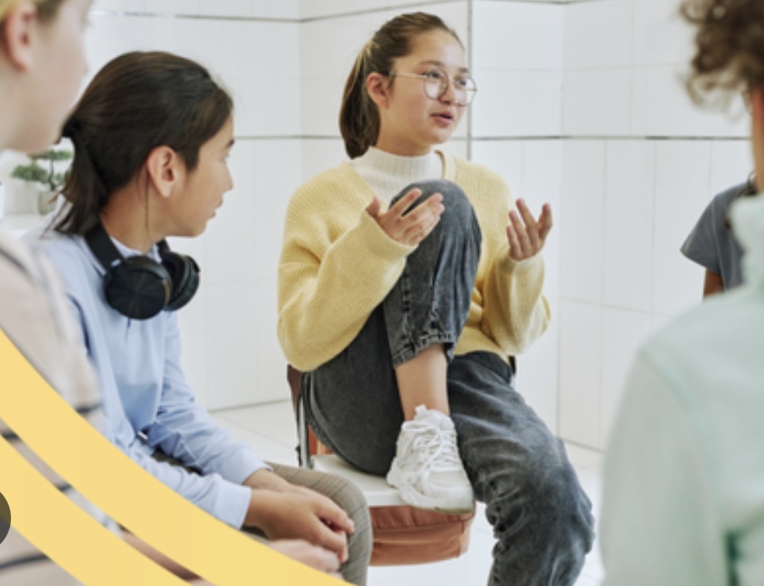 Young people in conversation during a community discussion